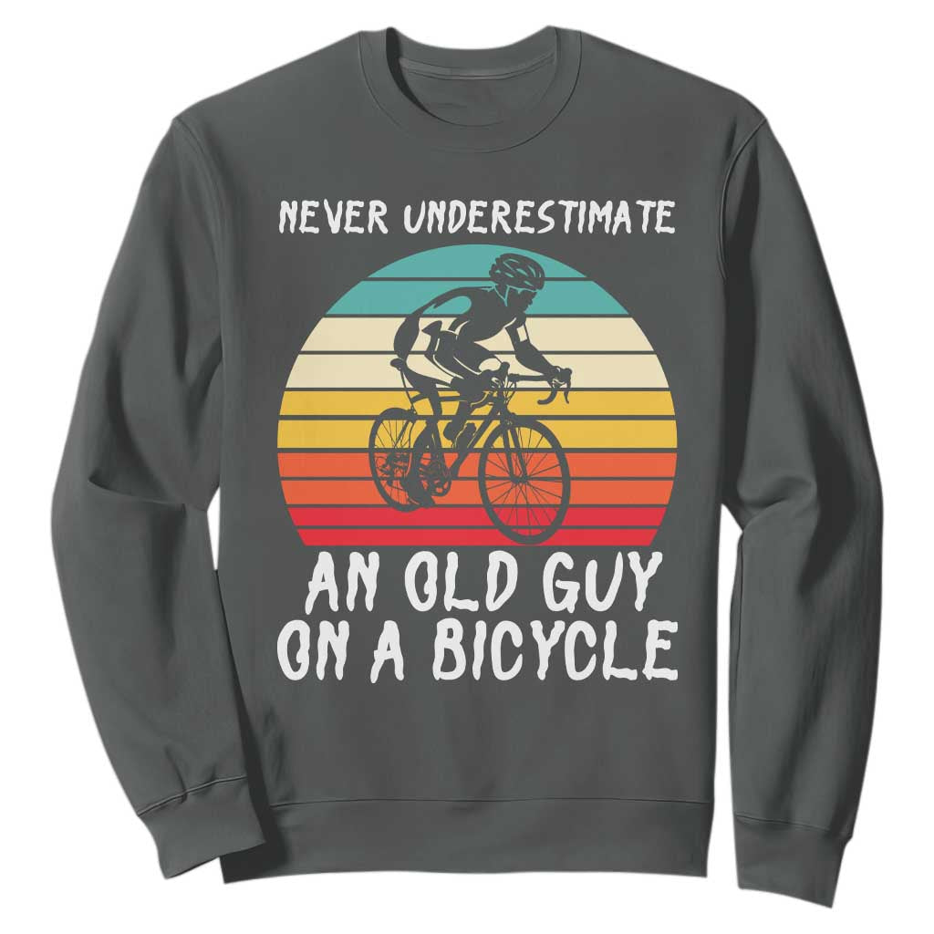 Never Underestimate An Old Guy On A Bicycle Sweatshirt Cycling Lover Gift TS12 Dark Heather Print Your Wear