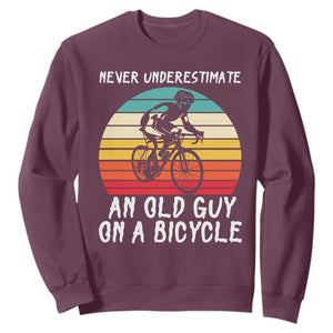 Never Underestimate An Old Guy On A Bicycle Sweatshirt Cycling Lover Gift TS12 Maroon Print Your Wear