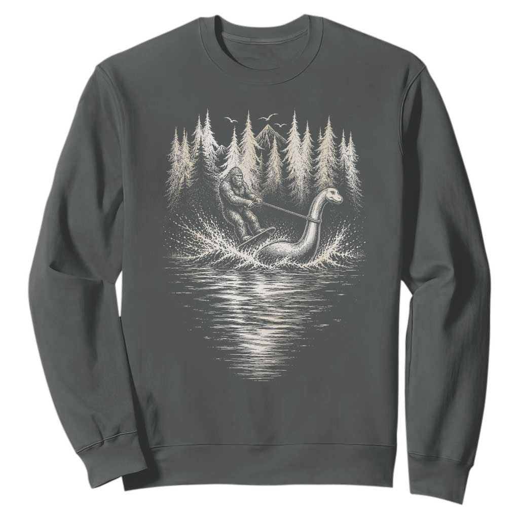 Funny Bigfoot Water Skiing Behind Nessie Sweatshirt Cryptid Lover TS12 Dark Heather Print Your Wear