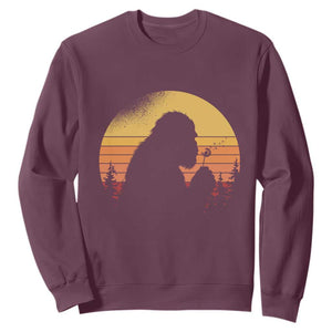 Bigfoot Blowing Dandelion Sweatshirt Retro Sunset Forest TS14 Maroon Print Your Wear