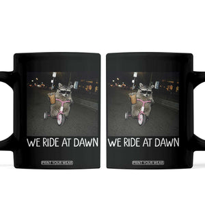 We Ride at Dawn Coffee Mug Funny Racoon Riding Tricycle Chaotic Meme TS14 Black Print Your Wear