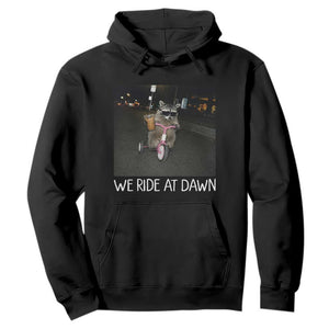 We Ride at Dawn Hoodie Funny Racoon Riding Tricycle Chaotic Meme TS14 Black Print Your Wear