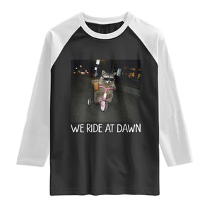 We Ride at Dawn Raglan Shirt Funny Racoon Riding Tricycle Chaotic Meme TS14 Black White Print Your Wear