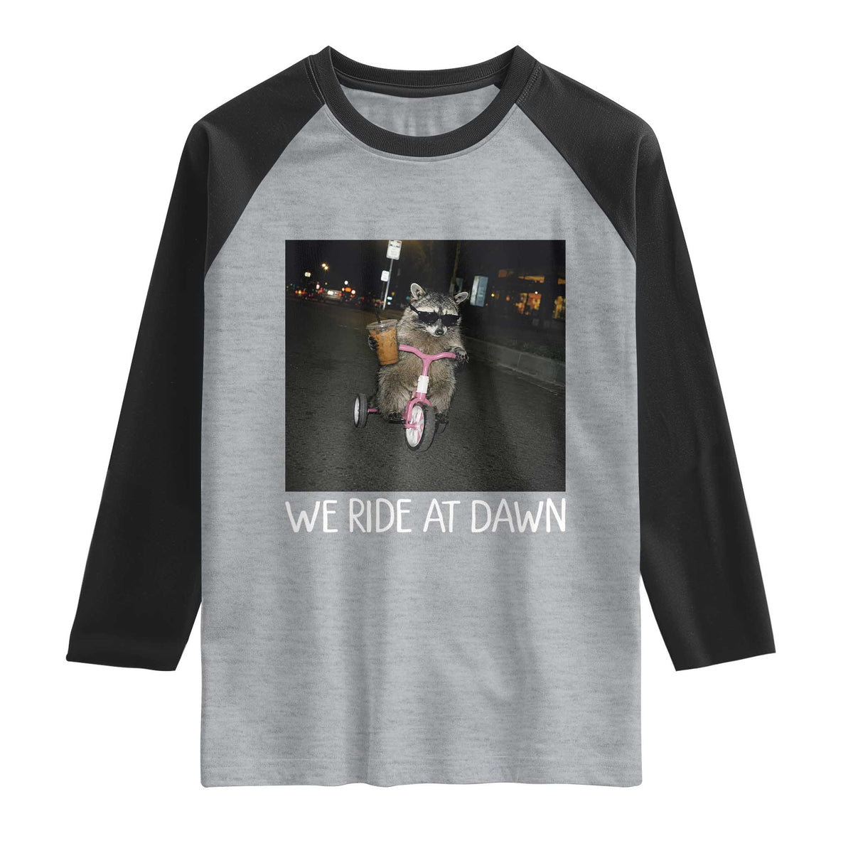 We Ride at Dawn Raglan Shirt Funny Racoon Riding Tricycle Chaotic Meme TS14 Heather Gray Black Print Your Wear