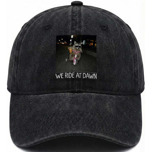 We Ride at Dawn Washed Cotton Baseball Cap Funny Racoon Riding Tricycle Chaotic Meme TS14 Print Your Wear