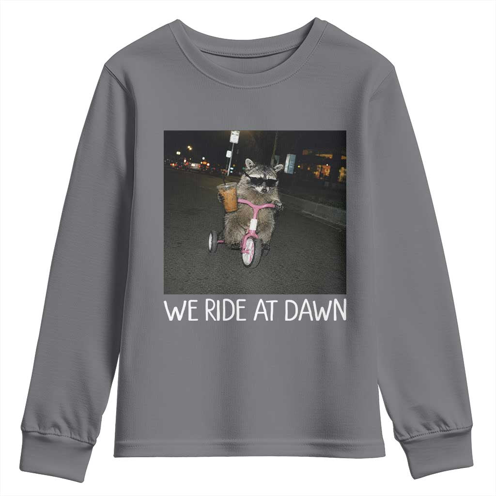 We Ride at Dawn Youth Sweatshirt Funny Racoon Riding Tricycle Chaotic Meme TS14 Charcoal Print Your Wear
