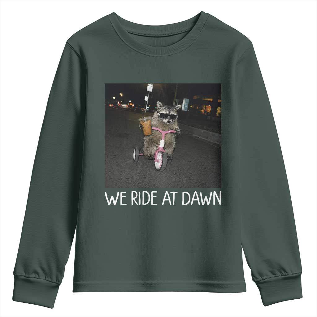 We Ride at Dawn Youth Sweatshirt Funny Racoon Riding Tricycle Chaotic Meme TS14 Dark Forest Green Print Your Wear