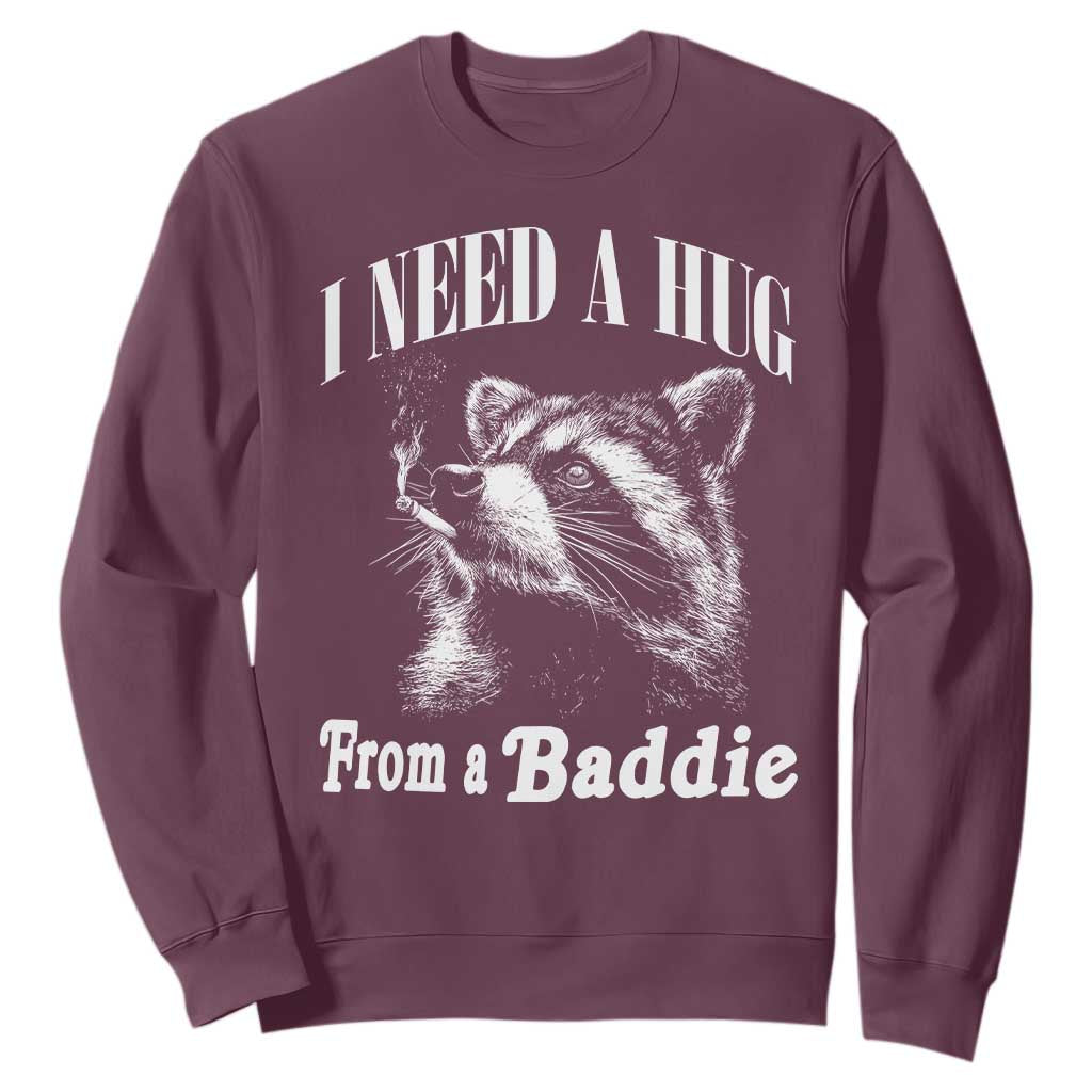 I Need A Hug from A Baddie Sweatshirt Funny Raccoon Smoking Sarcastic TS14 Maroon Print Your Wear